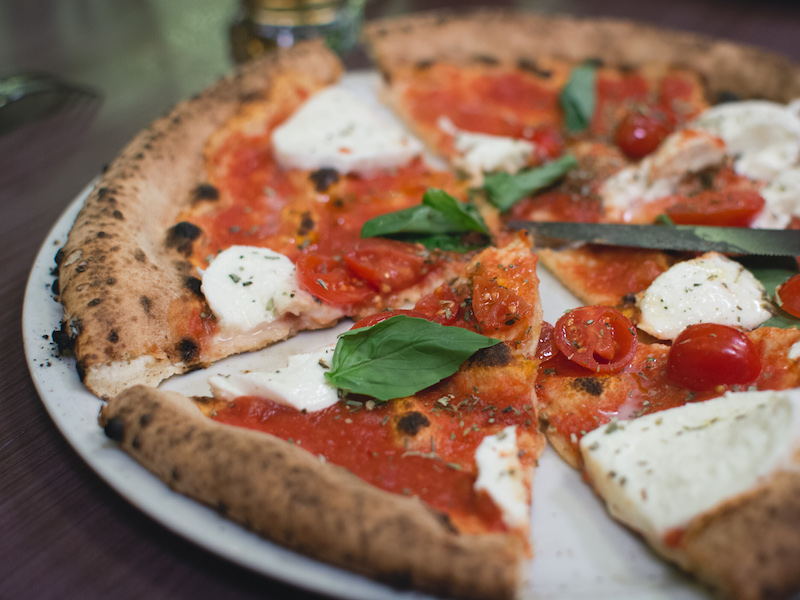 Simple italian pizza with cherry tomatoes

                    